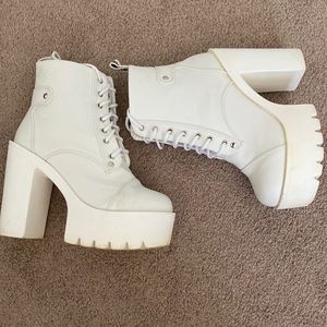 Sleek white heeled boots